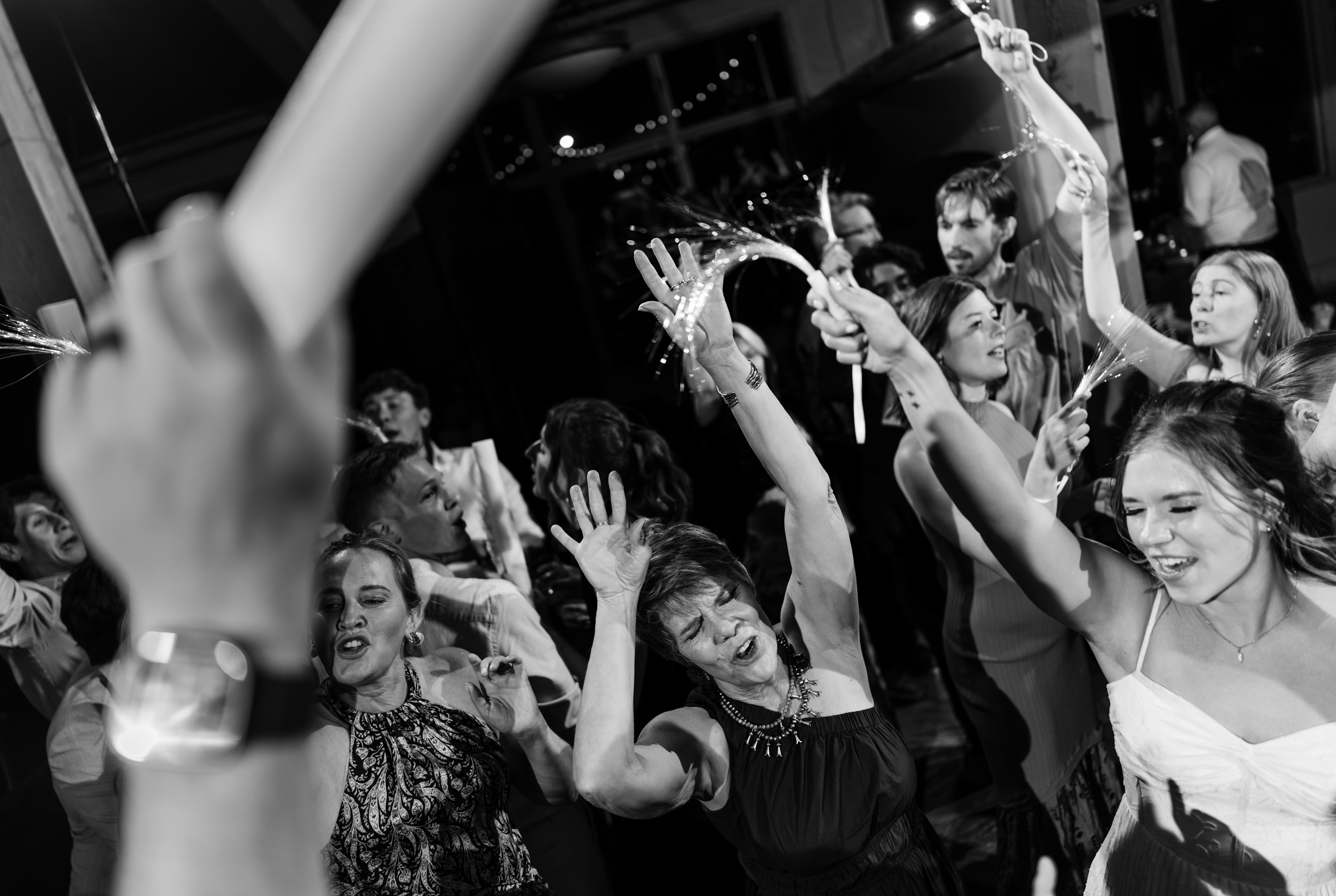 Crowd dancing and celebrating at a Millennial Romance show